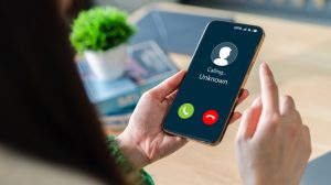 Human Use Smartphone With Incoming Call From Unknown Number Spam