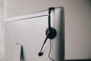 Power Dialer headset on computer monitor.